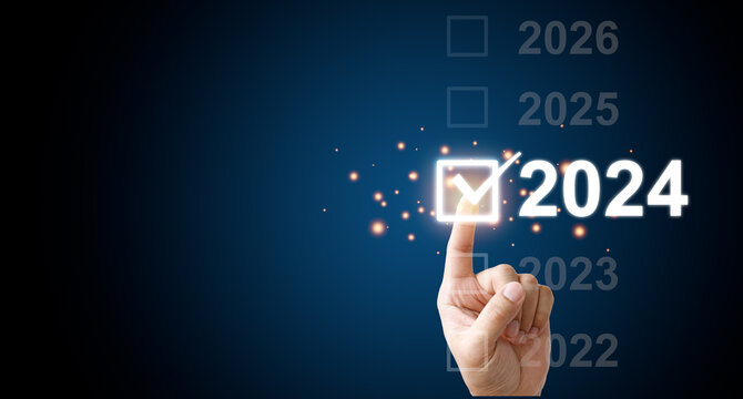 Finger touching to select 2024 year for starting new year and  merry Christmas, Start Business planing concept