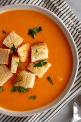 Homemade Butternut Squash Soup in a Bowl, top view. Flat lay, overhead, from above.