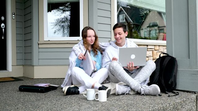 new creative ideas of youth boys girl communicate on porch come up with plans make ideas show on laptop in folder white cups tracksuits private sector Canada America Europe backpack attitude. smile