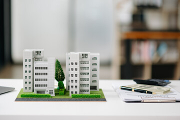balancing the property sector The real estate agent is explaining the house style to see the house...