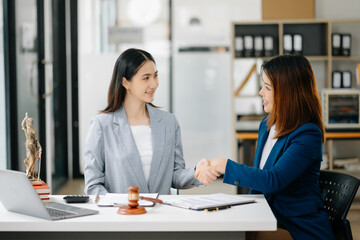 business people and lawyers discussing contract papers sitting at the table. Concepts of law, advice, legal services.