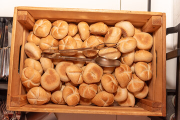 top down view on many bread rolls in a wooden box