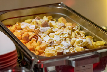 traditional austrian Kaiserschmarrn with sugar in a big bowl