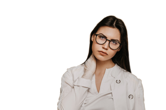 Exhausted female doctor in glasses and medical gloves  against transparent background, in medical gown looks tired after working all day long during coronavirus pandemic. Covid-19 virus concept