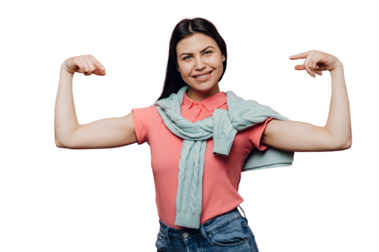 Young cute brunette dressed in pink t-shirt and turquoise sweater tied up over her shoulders, smiles happily, points at herself against transparent background, satisfied by her physical state