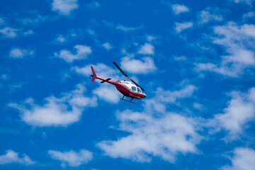 Helicopter flying in the blue sky