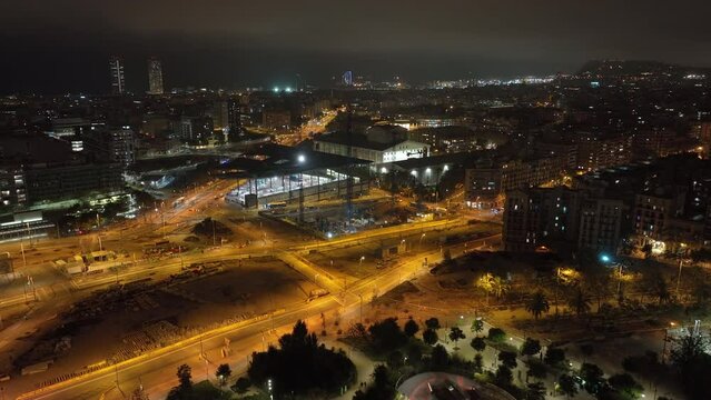 night illumination barcelona city traffic street crossroad famous encants market aerial panorama 4k spain