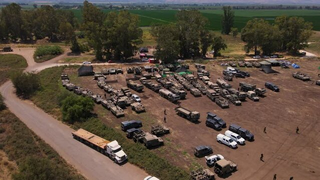 Civilian trucks transporting IDF Battle tanks to field on Gaza border