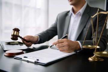 justice and law concept.Male judge in a courtroom on table and Counselor or Male lawyer working