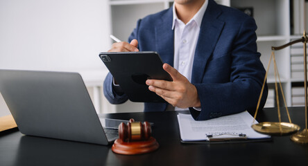 justice and law concept.Male judge in a courtroom on table and Counselor or Male lawyer working