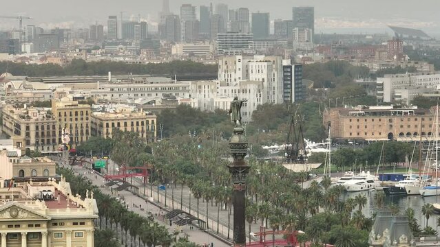 day time flight over barcelona cityscape traffic street famous christopher columbus monument top aerial panorama 4k spain