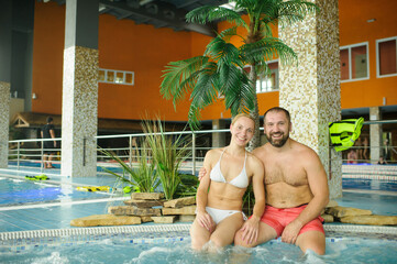 Portrait of a couple enjoying a vacation in the pool