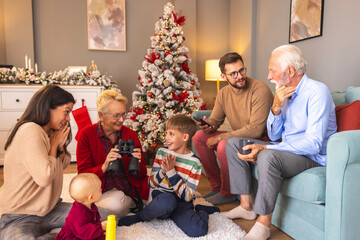 Happy multi-generation family spending Christmas day together at home