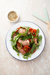 Arugula salad with roast beef and tomatoes