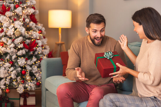 Couple in love exchanging Christmas presents