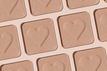 Minimal pattern eye shadow neutral beige swatches with shadow, monochrome photo, eyeshadow with heart imprint, skin colored powder for makeup, square shape metal pack, beauty cosmetic texture