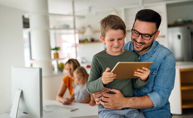 Father and child using digital tablet for e-learning. Education home digital device kid concept.
