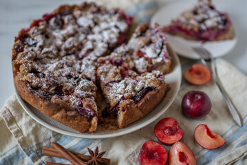 Homemade plum pie. Autumn plum pie. 