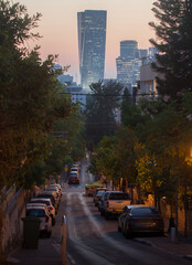 Tel Aviv glass tower at sunset. View from residential district