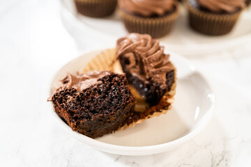 Chocolate Cupcake Sliced in Half on Kitchen Counter