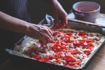 Close up shot of сhef's hands making pizza