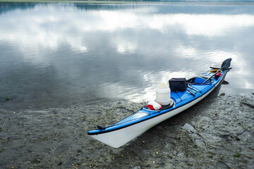 Kayak stranded on the grey sand