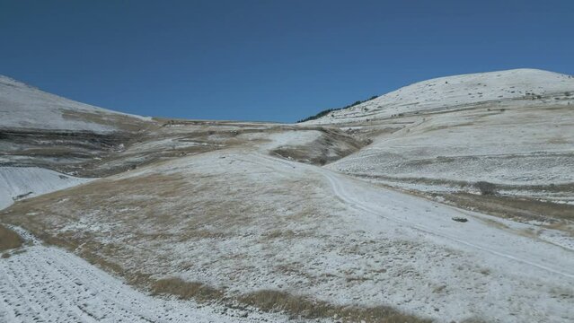A drone footage over Castelluccio - Italy during winter period with snow.
Beautiful place to hike and enjoy nature and silence.
Everything sorrounded by the Vettore's mouintain