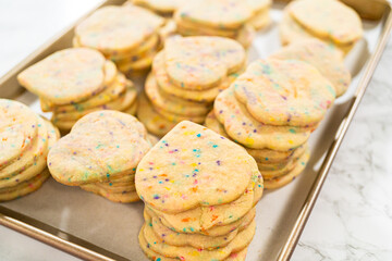 Packing Sprinkle-Adorned Sugar Cookies into Boxes