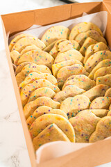 Packing Sprinkle-Adorned Sugar Cookies into Boxes