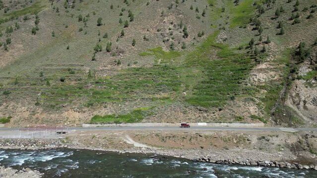 Aerial view of National Highway near Babusar Pass (13700ft) along with Kunhar river flowing and lush green fields on mountain slopes. Babusar pass connects Gilgit baltistan with khyberpakhtunkhwa