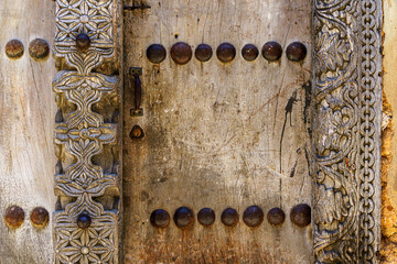 traditional cultural swahili door detail of arabic and indian origin - obrazy, fototapety, plakaty