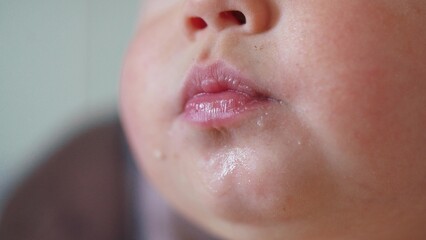close-up of baby dirty lips. happy family a kid dream concept. close-up baby lips in the kitchen...