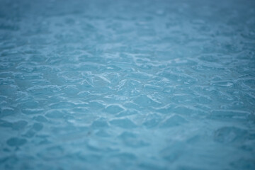 Cold water and ice cubes melting background. Global warming or climate change concept. Wim Hof...