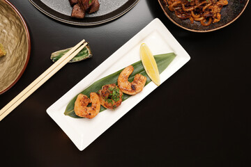 Spicy roasted shrimp in a white plate