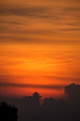 Beautiful orange sky during sunset over buildings at Pune India.