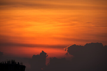 Beautiful orange sky during sunset over buildings at Pune India.
