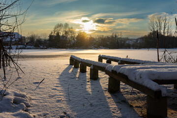Winter Sun over the frozen lake