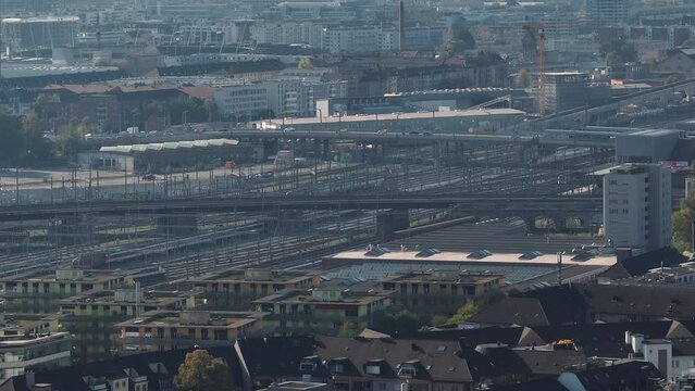 day time flight over zurich city train station railways aerial panorama 4k switzerland