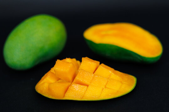 mango harumanis slice isolated on black. selective focus. shallow depth of field.