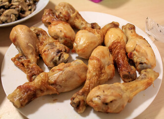 Close-up of the chicken drumsticks in the dish. Food Concept.