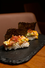 Traditional Japanese sushi set with vegetables and dry seaweed