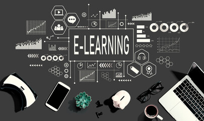 E-Learning theme with electronic gadgets and office supplies - flat lay