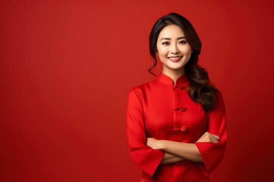 photo of woman wearing a cheongsam suit smiling to welcome tourists shopping in Chinese New Year, isolated on a single color background, copy space . generative ai