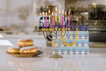 Hanukkah menorah lit in celebration of Jewish festival Hanukkiah candles lights