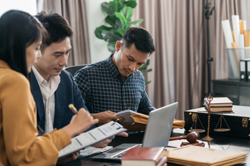 Business people and lawyers discussing contract papers sitting in the table at office in the morning. concepts of law, advice, legal services.