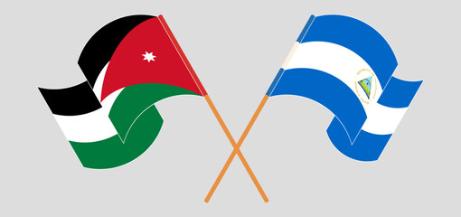 Crossed and waving flags of Jordan and Nicaragua