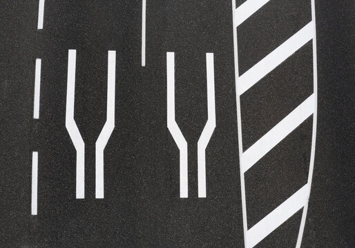 Road narrowing markings on asphalt road