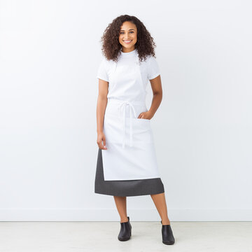 Full length shot of cook posing, wearing uniform isolated on white background
