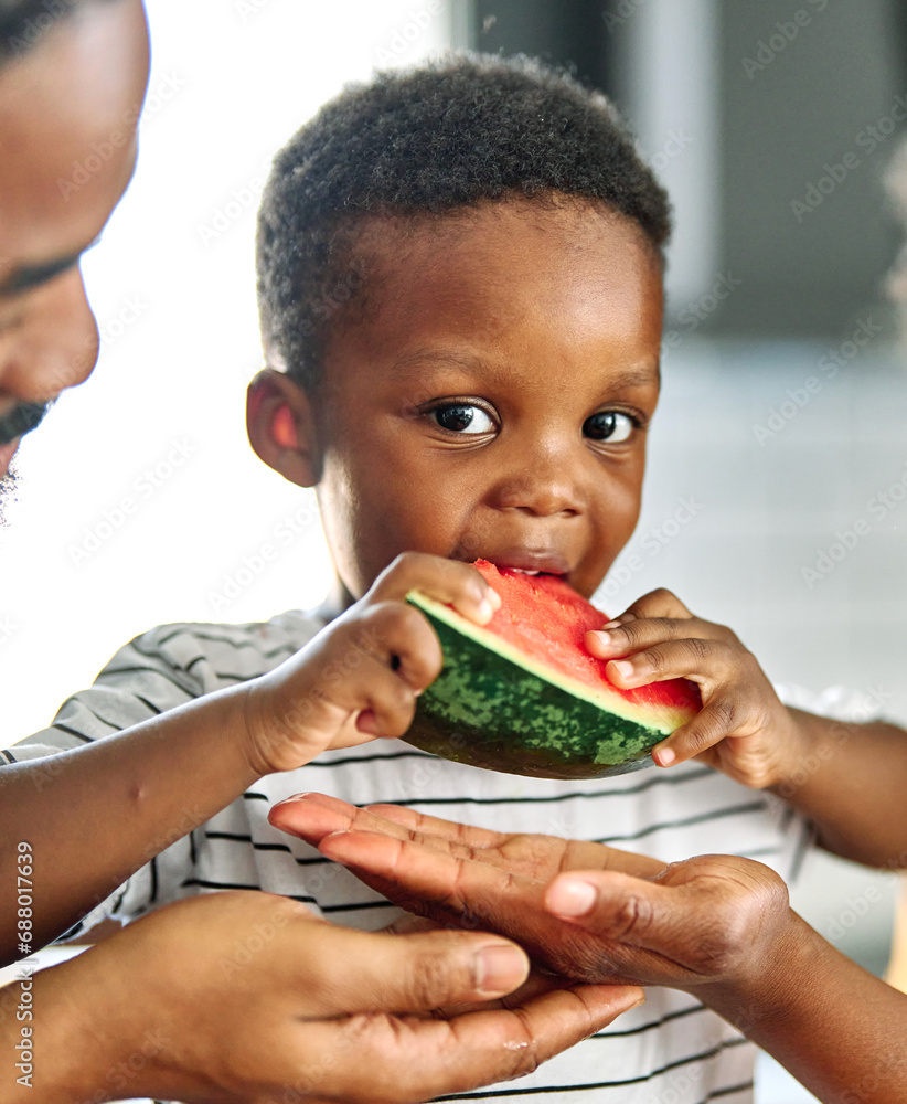 Wall mural child family kitchen food boy son father mother watermelon fruit slice summer organic meal fun preparing healthy diet eating home black