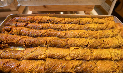 Turkish kadayıf. Fresh walnut kadayifs on the tray
